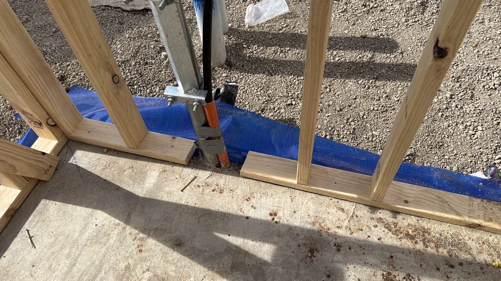 Bottom plate cut through in a bracing wall without an approved fix, found during a frame inspection in Truganina