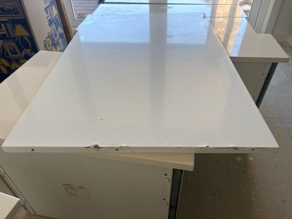Kitchen cabinets chipped and scratched from being stored on the slab, found during a defect investigation inspection in Derrimut