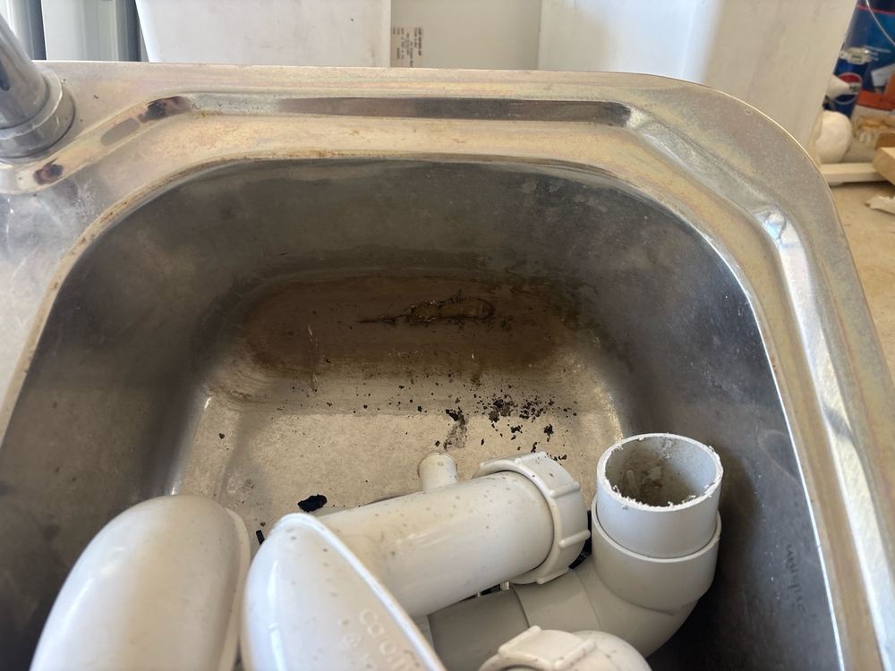 Pantry sink fitted with mould growth from poor storage before install, found during a defect investigation inspection in Derrimut