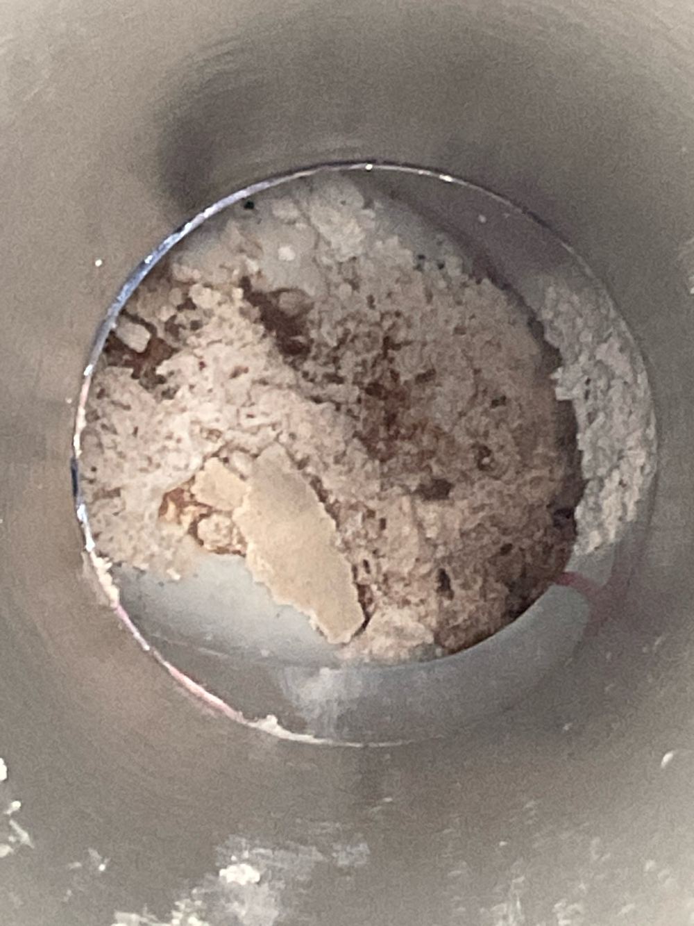 Stormwater pipe broken and blocked, needing repair and a camera check, found during a construction stage inspection in Truganina