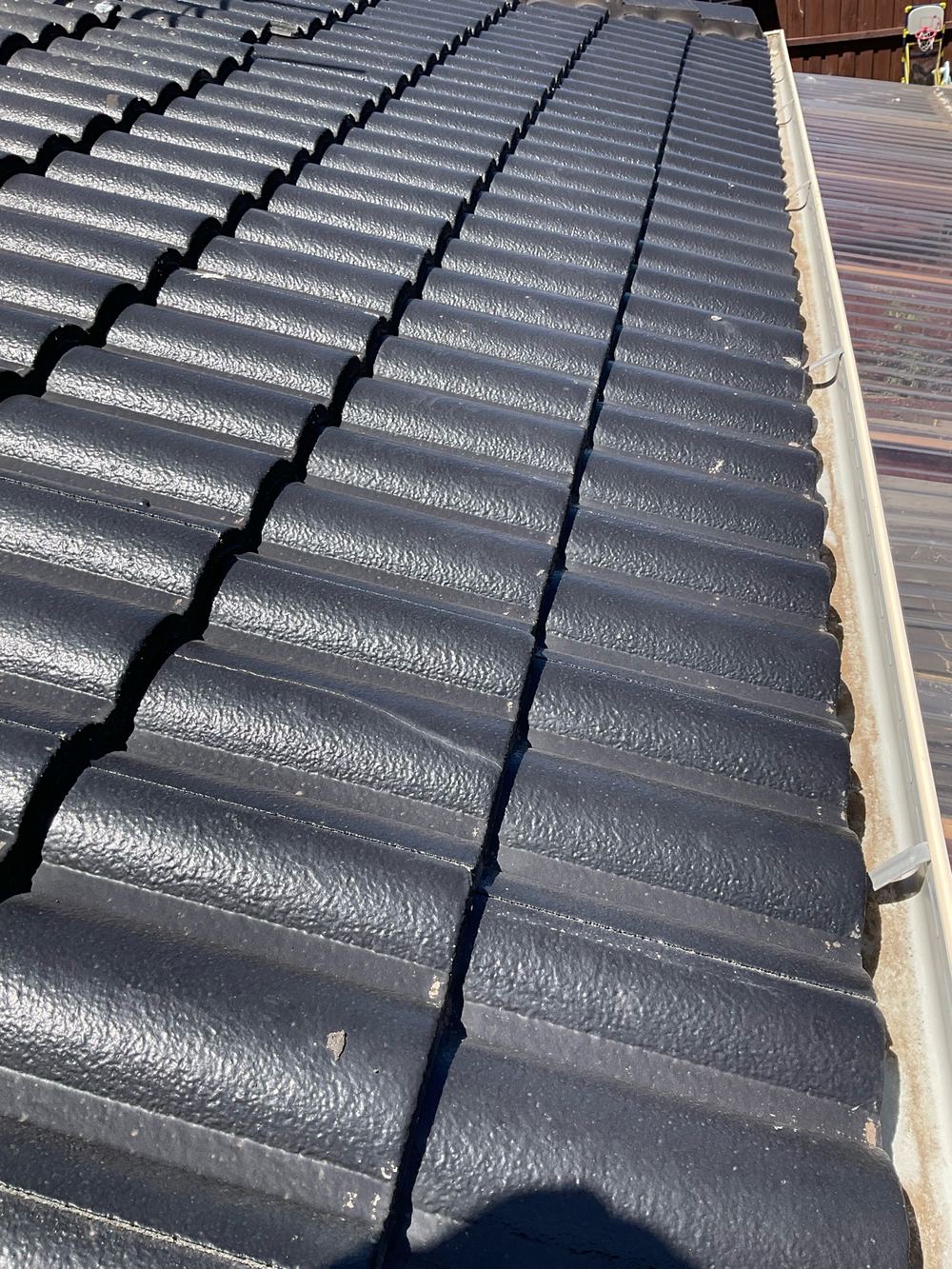 Cracked tiles that could let water through and need replacing soon, found during a pre-purchase inspection in Truganina